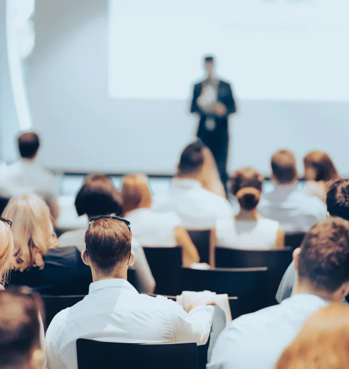 an event room with a speaker and audience
